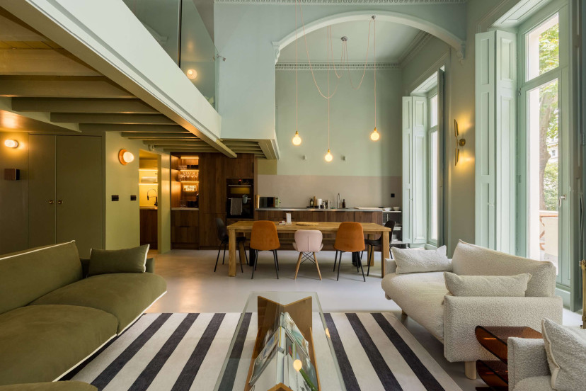 Open-plan kitchen with 10-seater dining table and spacious living room