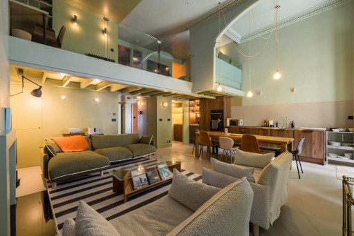 Open-plan kitchen with 10-seater dining table and spacious living room
