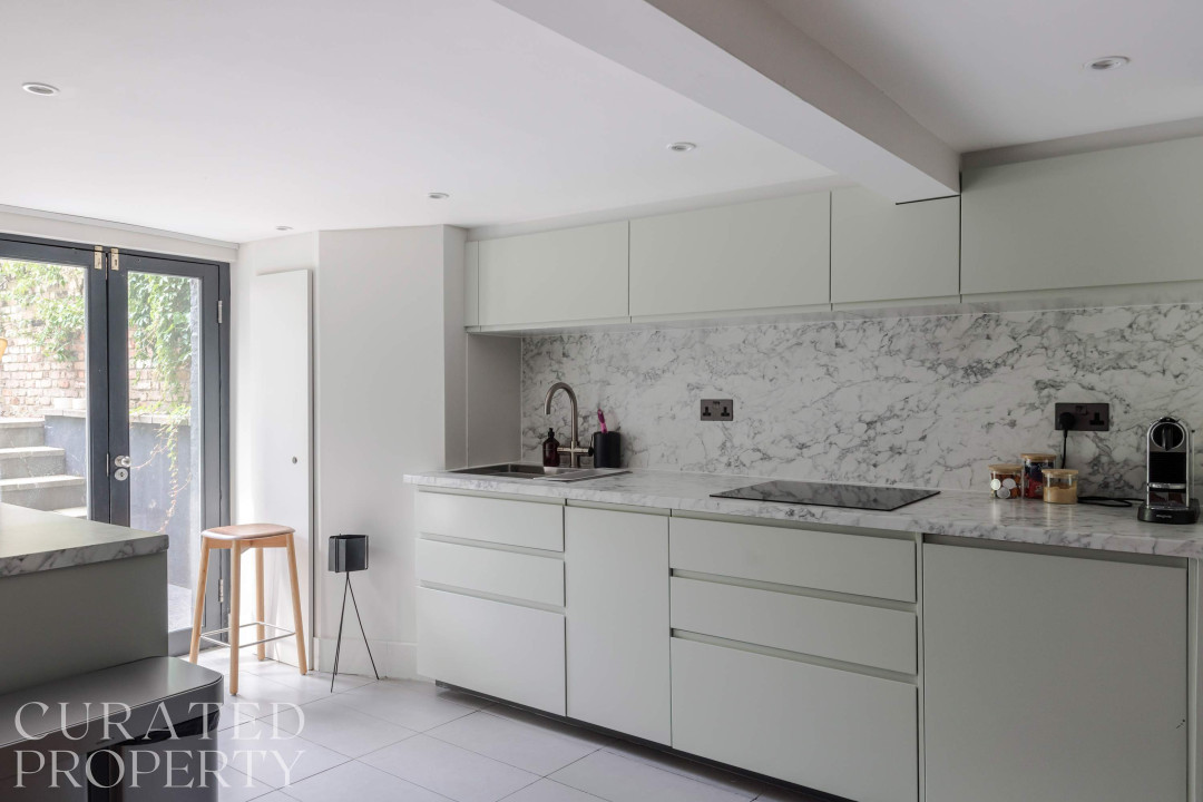 Islington Townhouse contemporary kitchen featuring a marble countertop