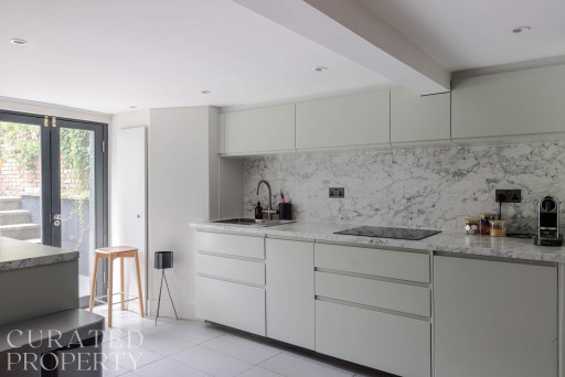 Islington Townhouse contemporary kitchen featuring a marble countertop