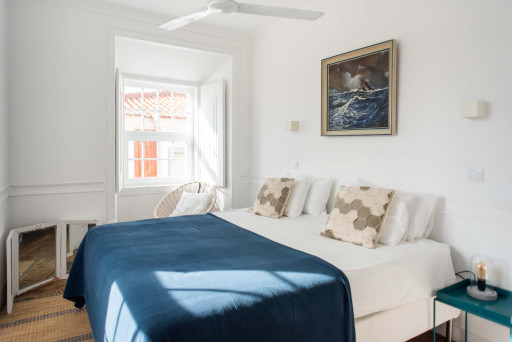Santo Antonio 2 bedroom, bathed in natural light, coastal-inspired decor, with a calming color palette.