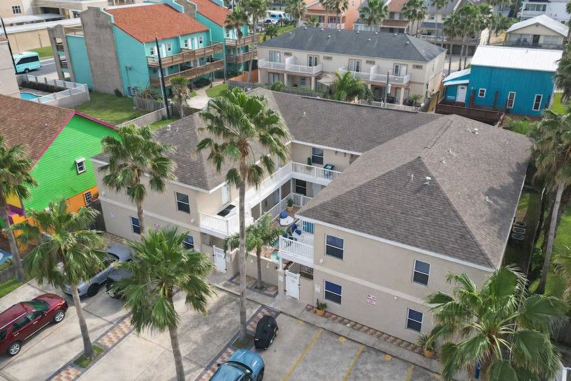 Vibrant Coastal Retreat with Pool, Palm Trees & Colorful Views – Walk to Beach, Sleeps 6+
