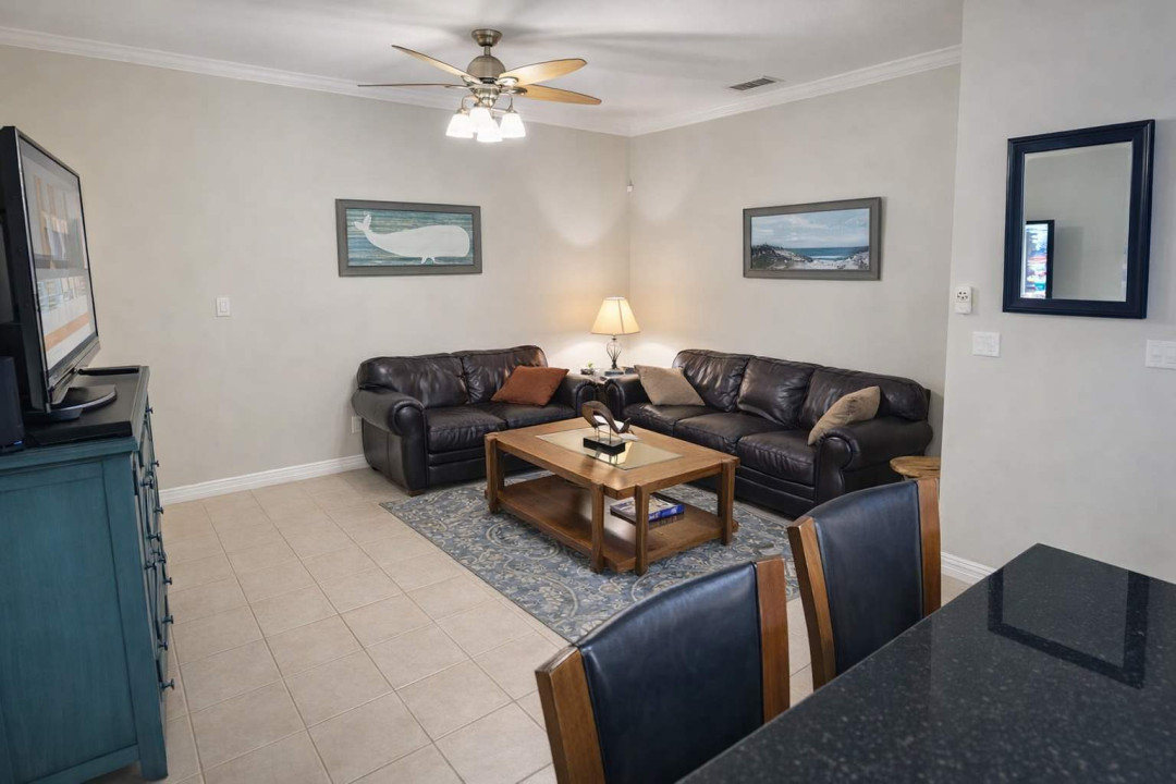 Cozy Coastal Living Room Retreat – Leather Sofas, Smart TV, Stylish Decor, Near Beach & Dining