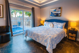 Poolside Bedroom Retreat
Wake up in a serene comfy bedroom with soft lighting, modern decor, and direct sliding-door access to the pool patio, perfect for quiet mornings, sunset lounging, or a peaceful night’s sleep by the water.