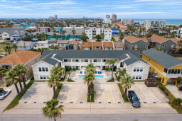 Modern Coastal Retreat with Pool & Parking – Steps from Beach, Dining & Entertainment. Spacious 2BR Units, Palm-Lined Courtyard, Ideal for Families & Groups.
