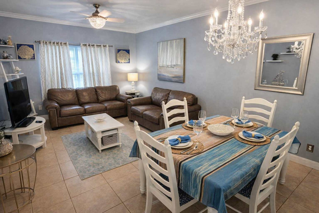 Coastal Chic Retreat: Bright 2BR with Crystal Chandelier, Leather Sofas, Set Dining Table & Beachy Decor Near Attractions