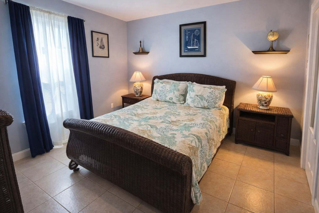 Coastal Comfort | Bright bedroom w/ Tropical Decor, Natural Light, & Nautical Accents – Steps to Beach & Dining