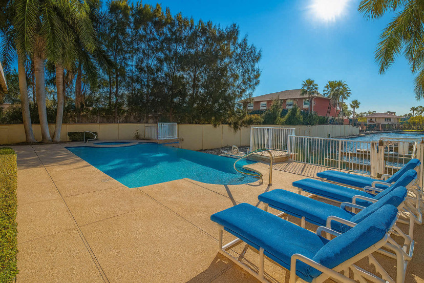 Tropical Poolside Oasis
Lounge on chaise chairs by the sparkling turquoise pool, framed by swaying palms and lush greenery. Sunny pavers lead to serene lagoon views—ideal for refreshing dips and ultimate relaxation in paradise!