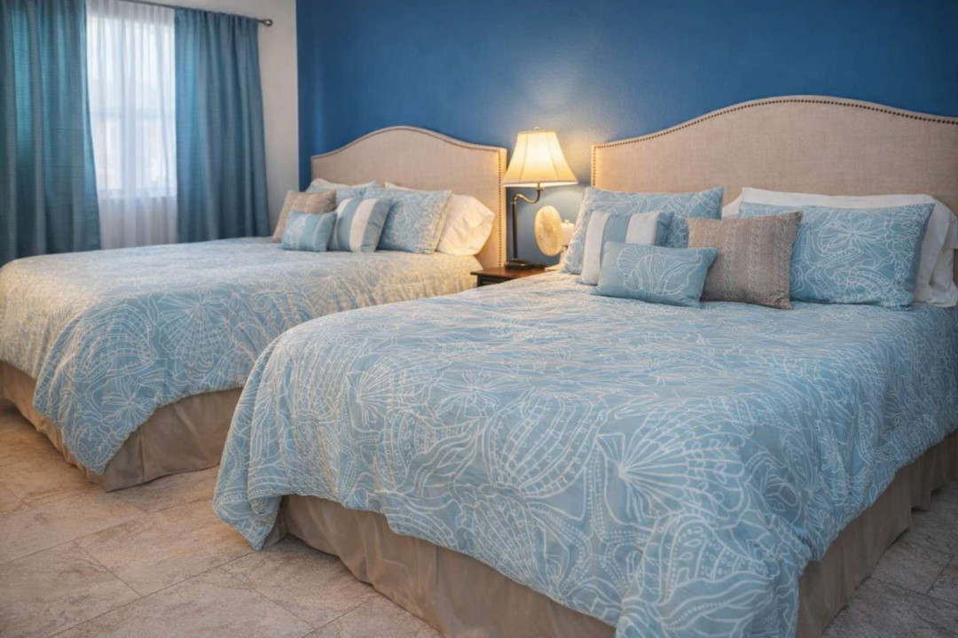 Coastal Comfort | 2 Beds | Deep Blue Accent Wall | Walk to Beach | Stylish Decor | Warm Lighting | Ideal for Families or Friends | Fast Wi-Fi | A/C | Peaceful Retreat in South Padre Island