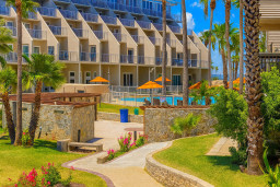 Modern Coastal Resort with Pool, Pergola & Lush Gardens — Steps from the Beach