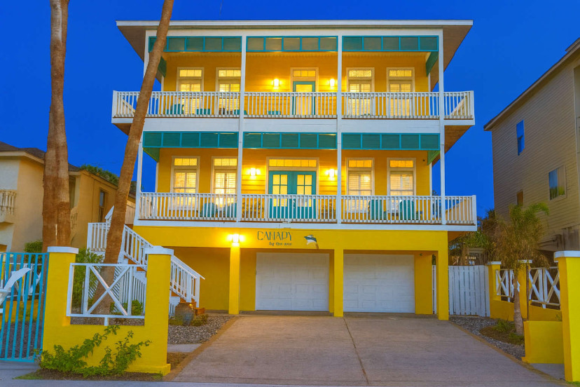 Welcome to Canary by the Sea—a vibrant coastal retreat with stunning patios and charming balconies. Enjoy modern comfort and beachy vibes in this inviting, brightly lit yellow home perfect for relaxing seaside vacations and gathering with loved ones.