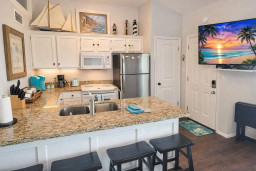 Bright Coastal Kitchen Retreat – Granite Counters, Stainless Appliances, Nautical Decor, Coffee Station, and Smart TV – Steps from Beach Fun & Relaxation