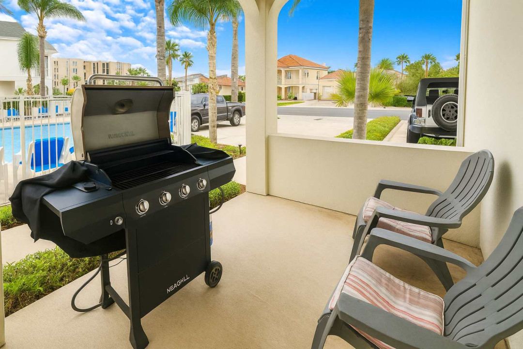 Fire up the grill and unwind on your patio, just steps from the pool! This inviting space is perfect for outdoor dining, relaxing in comfy chairs, and making the most of sunny island days with friends or family.