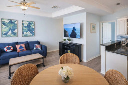 Coastal Retreat w/ Bright Interiors, Navy Sofa, Tropical Art, Full Kitchen & Dining Nook – Steps to Beach!