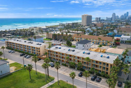 Beachside 3BR Retreat • Steps to Sand • Ocean Views • Parking • Palm-Lined Street • Walk to Dining & Shops