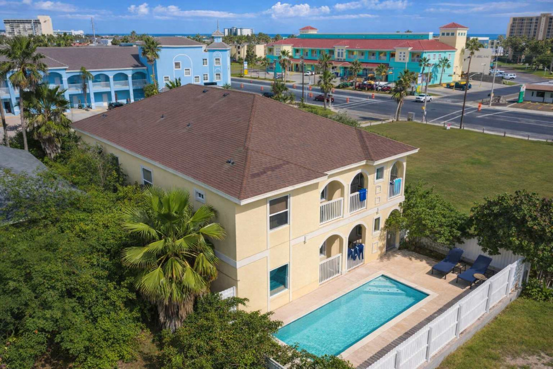 Bright 2BR Beachside Retreat w/ Sparkling Pool, Balconies, Lush Garden & Walk to Oceanfront Dining