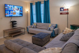 Cozy Living Room Retreat w/ Smart TV, Plush Seating & Natural Light — Perfect for Relaxing Evenings