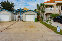 Clean, well‑maintained duplex with garage, a wide driveway, and a bright, inviting exterior—offering guests a comfortable, quiet home base.