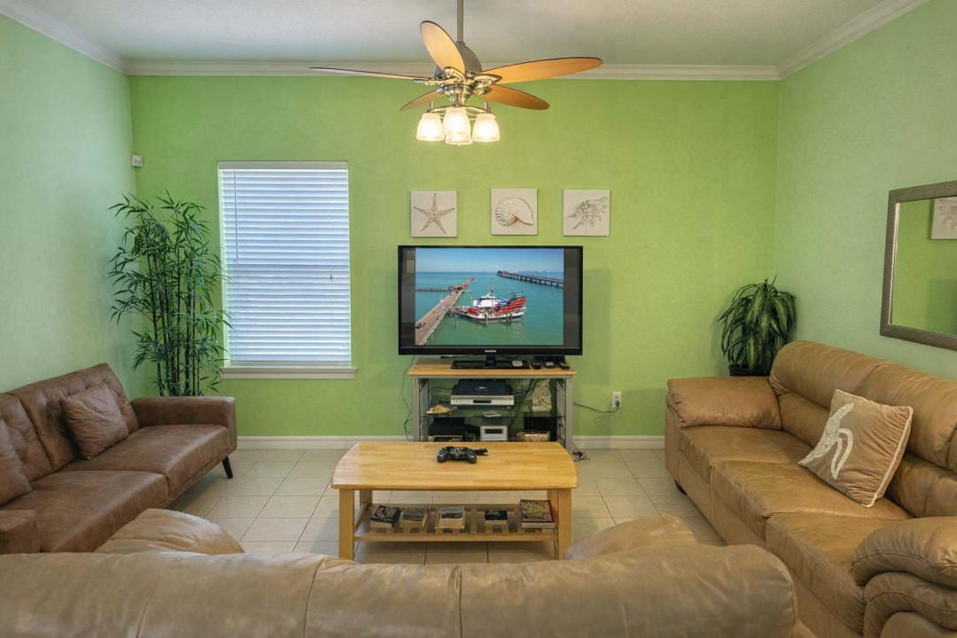 Bright Coastal Living Room w/ TV, Comfy Sofas & Tropical Decor – Steps to Beach & Dining