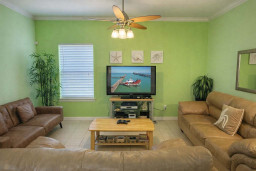 Bright Coastal Living Room w/ TV, Comfy Sofas & Tropical Decor – Steps to Beach & Dining