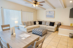 Spacious Coastal Retreat | Dining + Lounge | Near Beach
Relax in this bright, open-concept living & dining space with a comfy sectional, stylish décor and natural light. Enjoy meals at the wood dining table, unwind with smart TV & board games.