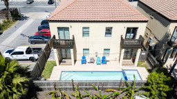 Relax in this bright two‑story retreat featuring a private pool, sun loungers, and lush greenery. Enjoy balcony views, spacious outdoor seating, and a peaceful neighborhood setting—perfect for unwinding after beach days and island adventures.