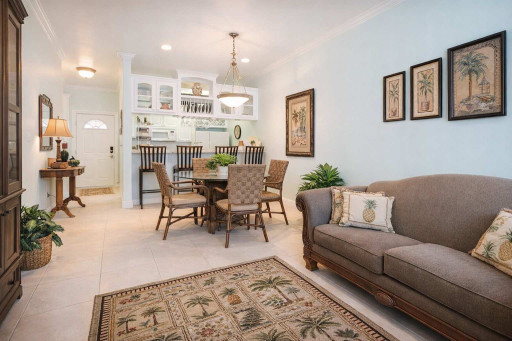 Bright, Coastal Kitchen & Entryway | Stylish Bar Seating, Tropical Accents, Glass Cabinets, and Inviting Decor Steps from the Beach