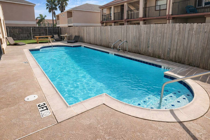 Relax by the sparkling pool at Mar Y Sol Condominiums—perfect for sunbathing, family fun, or a refreshing dip. Enjoy lounge chairs, picnic seating, and tropical vibes just minutes from the beach.