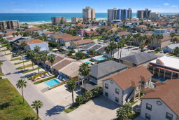 Bright coastal retreat with pools, palm-lined streets, and ocean views—perfect for families or groups seeking sun, space, and serenity just steps from the beach.
