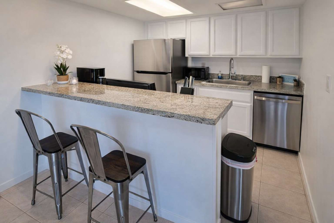 Modern Kitchen with Granite Counters & Stainless Steel Appliances — Bright, Clean, and Fully Equipped for Your Stay