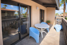Relaxing Balcony Retreat with Modern Seating & Tropical Views – Steps from Palm-Lined Courtyard, Ideal for Morning Coffee or Sunset Wind-Down