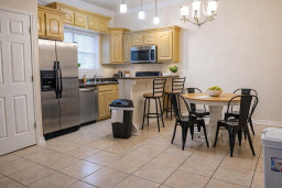 Modern kitchen & dining with granite counters, stainless steel appliances, pendant lighting, and cozy seating—perfect for cooking, gathering, and relaxing in style.