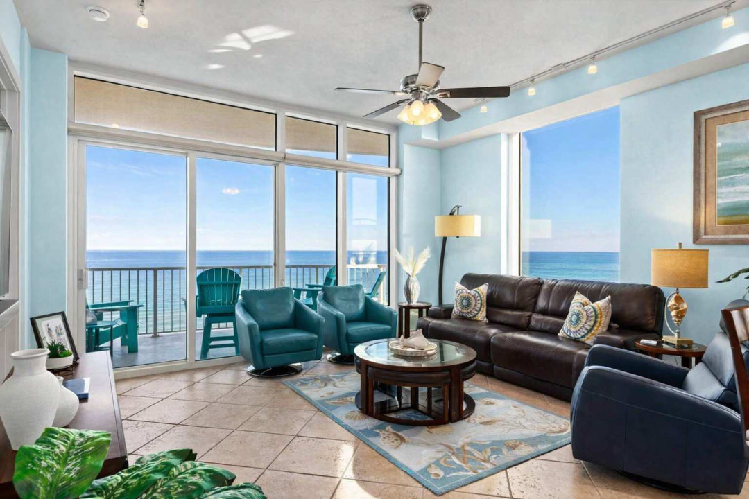 Oceanfront Living Room with Balcony, Teal Accents & Coastal Decor – Steps to the Beach, Bright Natural Light, and Relaxing Views
