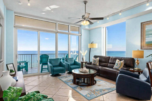Oceanfront Living Room with Balcony, Teal Accents & Coastal Decor – Steps to the Beach, Bright Natural Light, and Relaxing Views