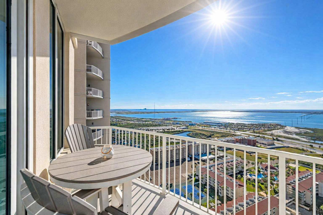 High-rise balcony with stunning coastal views, sunlit mornings, and resort-style amenities—perfect for relaxing or remote work.