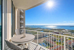 High-rise balcony with stunning coastal views, sunlit mornings, and resort-style amenities—perfect for relaxing or remote work.