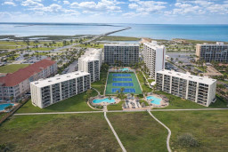 Modern beachfront resort with pools, tennis courts, and bay views—perfect for family getaways or group retreats. Walk to water, relax in style, and enjoy full amenities in a vibrant coastal setting.