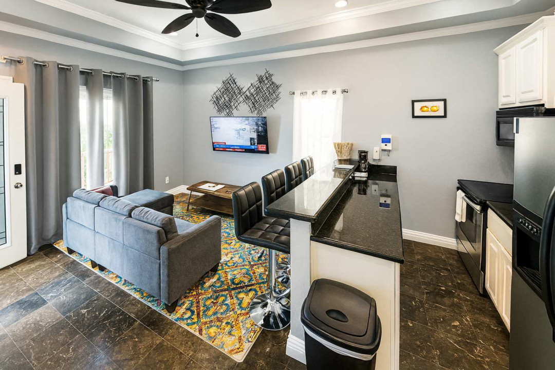 An easygoing open‑concept space where soft light, simple décor, and a relaxed living flow create a naturally welcoming feel. A comfortable spot to unwind, share moments, and settle into a stay that feels calm, connected, and effortlessly livable.