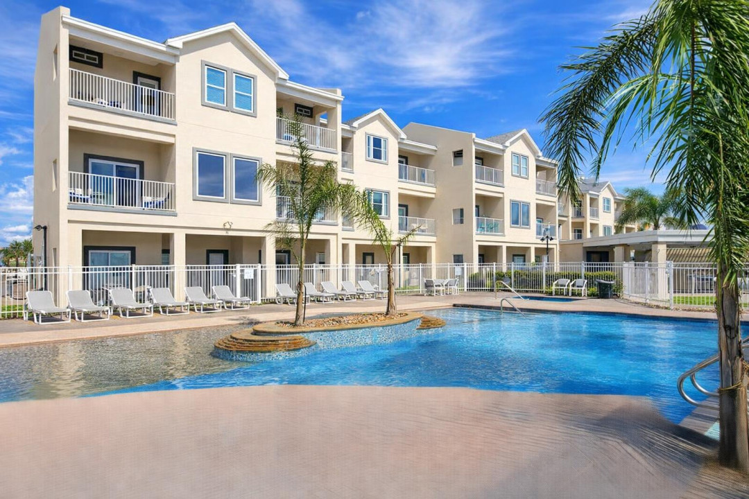 Resort-style condo with pool views, palm trees, and sun loungers—perfect for relaxing getaways near the beach. Bright interiors, private balconies, and a sparkling pool just steps from your door.