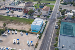 Bright coastal retreat with private pool, boat parking, and tennis courts—steps from beachside fun and dining. Ideal for families or groups seeking sun, space, and convenience in a vibrant vacation hub.