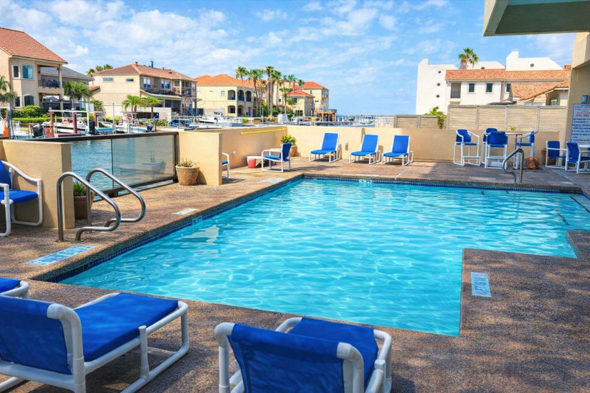 Waterfront Pool Retreat w/ Lounge Deck & Canal Views – Walk to Beach, Dining & Marina