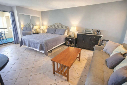 Modern Studio with Balcony & Kitchenette – Steps to Beach, WiFi, Queen Bed, Sofa, Coffee Station