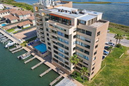 Waterfront condo with pool, boat slips & scenic canal views—steps from marina, minutes to beach. Spacious balconies, modern amenities, and resort-style relaxation in prime South Padre Island location.