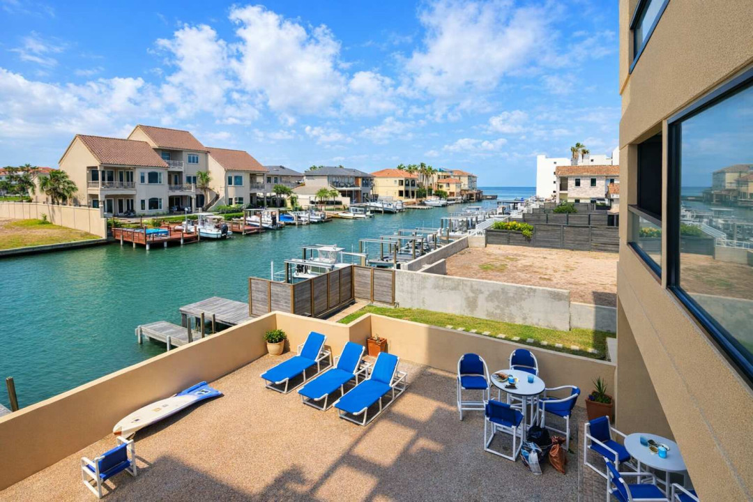 Waterfront Patio Retreat w/ Canal Views, Lounge Seating, & Direct Dock Access — Steps to Open Water