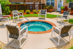 Relax and recharge in the shared spa at Surfside I. Surrounded by comfortable seating and lush gardens, it's the perfect spot to soak, socialize, and unwind after a day at the beach or exploring the coast.