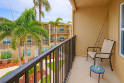 Unwind on your balcony with relaxing views of lush palms and courtyard below. Enjoy a quiet drink, cast a line with the provided fishing pole, or simply soak up the island breeze in this peaceful outdoor retreat.