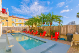 Private Tropical Pool Paradise
Refreshing private pool oasis awaits! Lounge on red Adirondack chairs amid swaying palms under sunny skies. Fenced backyard bliss, perfect for cooling off after beach days. Ultimate relaxation spot!