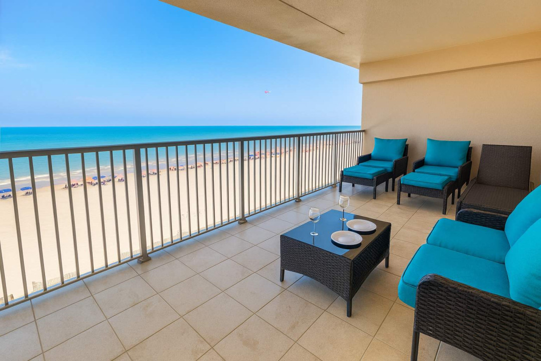 Sip and savor the views from a spacious, private balcony with plush seating and breathtaking Gulf-front vistas. Relax above the sandy beach, soaking in the ocean breeze and unforgettable sunrises—perfect for peaceful mornings or sunset cocktails.