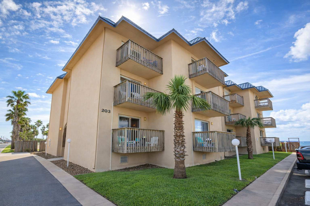 Coastal Condo w/ Balcony, Palm Views & Steps to Beach – Bright, Breezy & Walkable Location