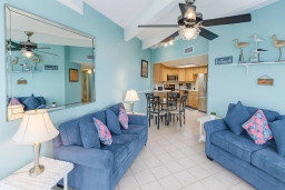 Bright Beach-Themed Retreat | Walk to Shore + Full Kitchen
Cozy coastal escape with open living/dining, full kitchen, and vibrant beach decor. Relax on plush sofas, dine under vaulted ceilings, and enjoy stainless appliances.